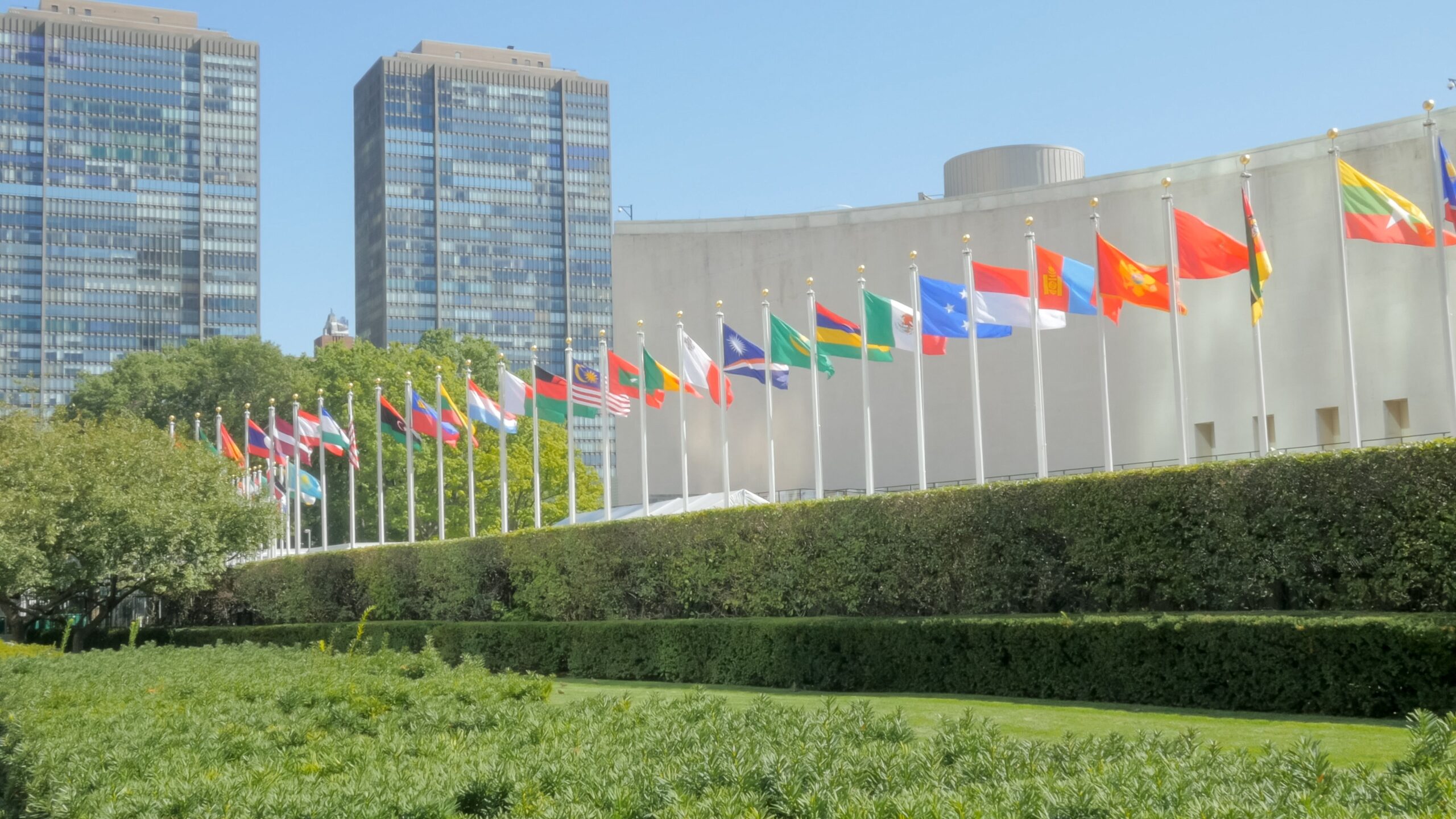 some of the national flags outside the united nations building in new york